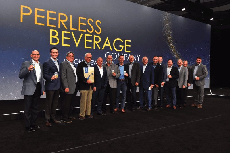 Peerless Beverage Company accepts the Gold Standard Award Peerless